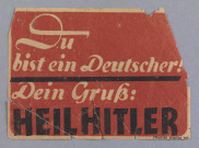 Etiquette encollée : "Du bist ein Deutscher ! Dein Gruss : Heil Hitler"